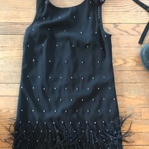 Black bejeweled and feathered flapper style dress.